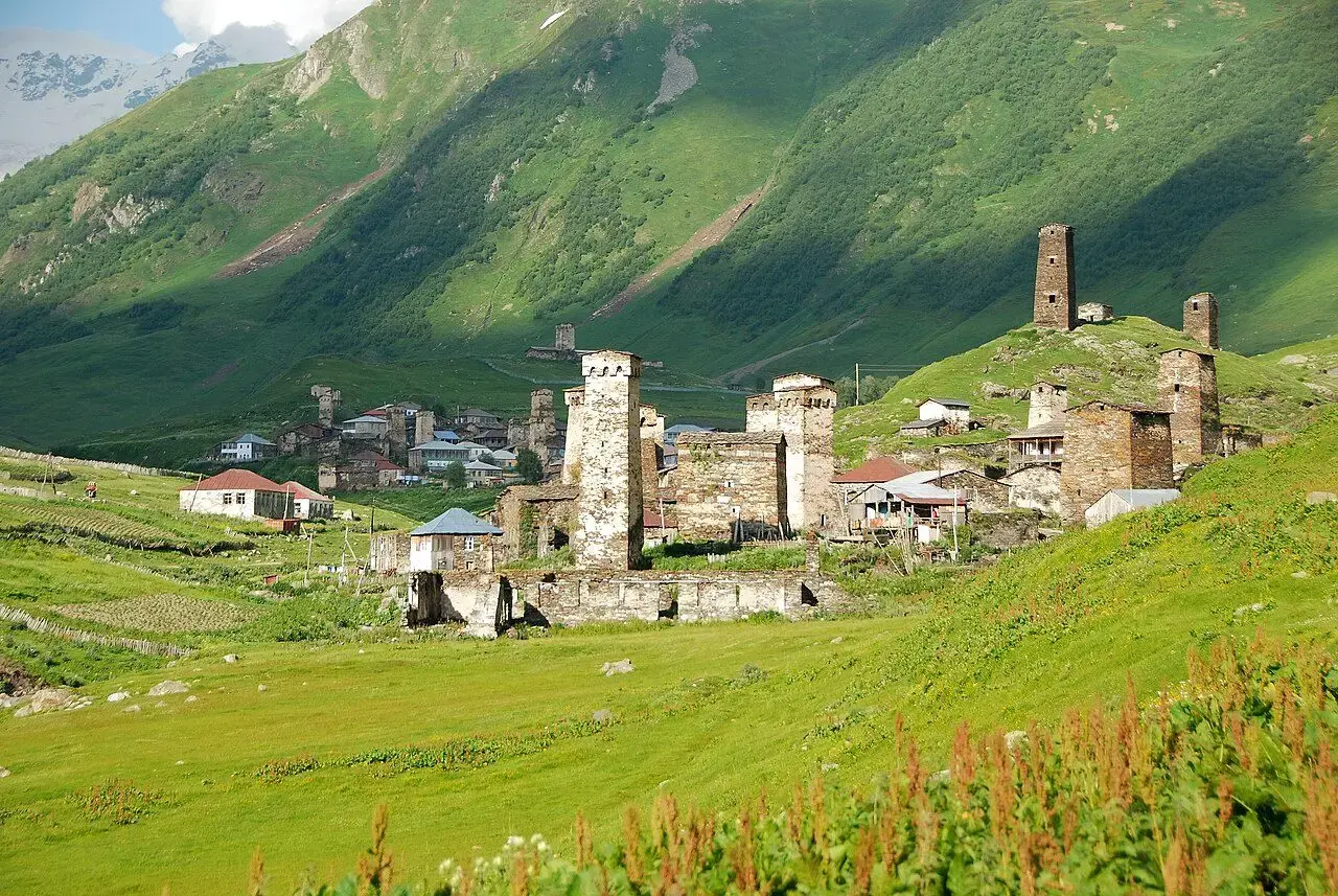 Stone Svan towers of Ushguli in a green valley